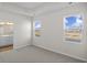 Bright bedroom with two windows and view of backyard at 3050 Deerberry Place, Longs, SC 29568