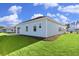 Light blue house exterior with landscaped lawn at 3050 Deerberry Place, Longs, SC 29568