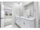 Bathroom with double vanity and a large mirror at 3087 Dover Branch Dr., Little River, SC 29566