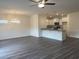 Open-concept living space featuring wood-look flooring, chandelier, and ceiling fan at 938 Oak Hollow St., Longs, SC 29568