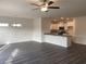 Living area adjacent to the kitchen with modern light fixtures and flooring at 938 Oak Hollow St., Longs, SC 29568