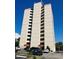 Ocean Villas building exterior, featuring multiple floors and ample parking at 7509 N Ocean Blvd., Myrtle Beach, SC 29572