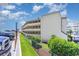 Beachfront condo building showcasing its side elevation and landscaping at 9620 Shore Dr. # 303, Myrtle Beach, SC 29572