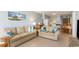 Open living room with sectional sofa and ocean-themed decor at 9620 Shore Dr. # 303, Myrtle Beach, SC 29572