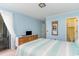 Bedroom with striped bedding, dresser, and access to balcony at 9620 Shore Dr. # 303, Myrtle Beach, SC 29572