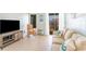 Living room with comfortable seating, a TV, and balcony access at 9620 Shore Dr. # 303, Myrtle Beach, SC 29572