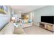 Spacious living room with sectional sofa and view into kitchen at 9620 Shore Dr. # 303, Myrtle Beach, SC 29572