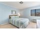 Bedroom with striped bedding and light blue walls at 9620 Shore Dr. # 303, Myrtle Beach, SC 29572