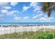 Stunning ocean view from the beach with vibrant umbrellas and beach activity at 9620 Shore Dr. # 303, Myrtle Beach, SC 29572