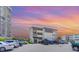 Building exterior with parking in the evening at 9620 Shore Dr. # 303, Myrtle Beach, SC 29572