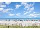 Expansive beach view with umbrellas and beachgoers enjoying a sunny day at 9620 Shore Dr. # 303, Myrtle Beach, SC 29572