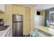 Well-equipped condo kitchenette with stainless steel refrigerator at 2701 South Ocean Blvd. # 710, North Myrtle Beach, SC 29582