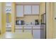 Small galley kitchen with white cabinets, microwave, and coffee maker at 2701 South Ocean Blvd. # 710, North Myrtle Beach, SC 29582