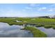 Private dock with gazebo offering serene waterfront access at 194 South Cove Pl. # D, Pawleys Island, SC 29585