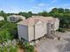 Multi-unit building with parking and surrounding trees at 194 South Cove Pl. # D, Pawleys Island, SC 29585