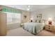 Primary bedroom with king-size bed, ceiling fan, and window seating at 194 South Cove Pl. # D, Pawleys Island, SC 29585
