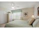 Primary bedroom with king-size bed, ceiling fan, and window seating at 194 South Cove Pl. # D, Pawleys Island, SC 29585