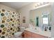 Clean bathroom with shower/tub combo and updated vanity at 194 South Cove Pl. # D, Pawleys Island, SC 29585