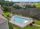 Community pool with surrounding patio furniture and landscaping at 194 South Cove Pl. # D, Pawleys Island, SC 29585