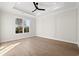 Bedroom with hardwood floors, ceiling fan and large window at 110 Brian Oaks Trail, Aynor, SC 29511