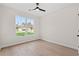 Bright bedroom with wood-look floors and large window at 110 Brian Oaks Trail, Aynor, SC 29511