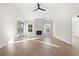 Living room with hardwood floors, fireplace, and sliding glass doors at 110 Brian Oaks Trail, Aynor, SC 29511