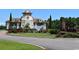 Gated community entrance with a charming, unique guardhouse and fountain at 583 Starlit Way, Myrtle Beach, SC 29579