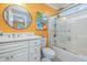 Bright bathroom with white vanity, shower, and toilet at 919A N Waccamaw Dr., Murrells Inlet, SC 29576