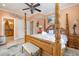 Main bedroom with a four-poster bed and en-suite bathroom at 919A N Waccamaw Dr., Murrells Inlet, SC 29576