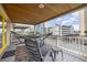 Relaxing deck with chairs, hammock, and ocean view at 919A N Waccamaw Dr., Murrells Inlet, SC 29576