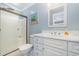 Bathroom with shower, toilet, and white vanity at 919A N Waccamaw Dr., Murrells Inlet, SC 29576
