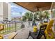 Relaxing front porch with yellow chairs and ocean view at 919A N Waccamaw Dr., Murrells Inlet, SC 29576