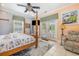 Bright bedroom with a post bed and ocean access at 919A N Waccamaw Dr., Murrells Inlet, SC 29576