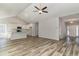 Vaulted ceiling living room with hardwood floors and kitchen view at 58 Millsite Ct., Georgetown, SC 29440