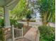 Brick walkway to charming home with white picket fence and lush landscaping at 120 A Da Gullah Way # A, Pawleys Island, SC 29585