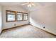 Bedroom with three windows and carpeted floor at 120 A Da Gullah Way # A, Pawleys Island, SC 29585