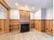 Finished basement recreation room with built-in shelving and fireplace at 120 A Da Gullah Way # A, Pawleys Island, SC 29585