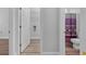 Clean bathroom with purple shower curtain and a white vanity at 885 Palmetto Trail # 201, Myrtle Beach, SC 29577