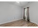 Well-lit bedroom featuring wood-look floors and a window with neutral curtains at 885 Palmetto Trail # 201, Myrtle Beach, SC 29577