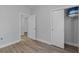 Light and airy bedroom with wood-look floors and access to another room at 885 Palmetto Trail # 201, Myrtle Beach, SC 29577