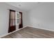 Simple bedroom with a large window and brown curtains at 885 Palmetto Trail # 201, Myrtle Beach, SC 29577