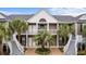 Front view of a two-story townhouse with gray siding and white trim at 885 Palmetto Trail # 201, Myrtle Beach, SC 29577
