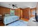 Main bedroom with wood paneled walls and a ceiling fan at 2403 Park St., North Myrtle Beach, SC 29582
