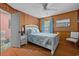 Charming bedroom with wood floors, a white bed frame, and a view of the bathroom at 2403 Park St., North Myrtle Beach, SC 29582