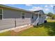 Gray house exterior with a porch, steps, and a landscaped yard at 2403 Park St., North Myrtle Beach, SC 29582