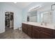 Double vanity bathroom with a large mirror and walk-in closet at 1225 White Fox Ct., Conway, SC 29526
