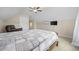 Spacious bedroom with a ceiling fan, TV, and comfortable recliner at 1225 White Fox Ct., Conway, SC 29526