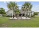 Charming home with a spacious backyard, palm trees, and a covered patio at 1225 White Fox Ct., Conway, SC 29526