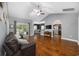Open living room with hardwood floors, vaulted ceiling, and view of kitchen at 1225 White Fox Ct., Conway, SC 29526