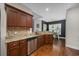 Kitchen boasts granite countertops, stainless steel appliances, and rich wood cabinetry at 1225 White Fox Ct., Conway, SC 29526